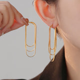 Ohrringe mit weicher Kette und Quaste – Gold