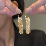Elegante lange Quasten-Ohrringe – Gold