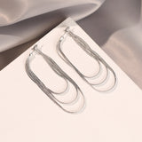 Ohrringe mit weicher Kette und Quaste – Silber