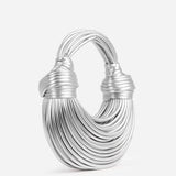 Luxuriöse goldfarbene Tasche mit skulpturalem Griff – Silber