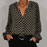 Renata - Langärmelige Bluse mit geometrischem Muster und lockerer Passform – Schwarz