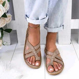 Alma - Flache Sandalen mit gekreuzten Riemen – Grau