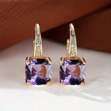 Goldene Ohrringe mit mystischem Steinkreis – Amethyst