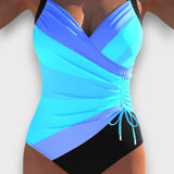 Nerine – Schwarzer Badeanzug mit raffiniertem Twist – Blau
