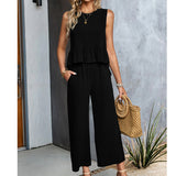 Celeste - Ärmelloser Jumpsuit mit weitem Bein und Rüschen – Schwarz