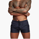 Herren Badeshorts mit Kordelzug und Seitentaschen mit Reißverschluss – Marineblau