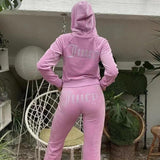 Juicy Damen Trainingsanzug mit Glanz – Hellrosa