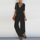 Bianca - Weißer Jumpsuit mit überkreuztem Ausschnitt und weitem Bein – Schwarz