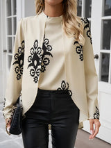 Veloria – Schicke, hochgeschlossene Longline-Bluse mit kunstvollem Print – Beige