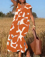 Goldie – Maxikleid mit abstraktem Print – Orange