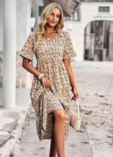 Veloura – Vintage-Kleid mit V-Ausschnitt und Blumenmuster – Aprikose