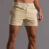 Superstretchige Trainingsshorts für Herren – Gelb