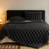 Calyra | Kuscheldecke mit weicher Blasenstruktur – Grau
