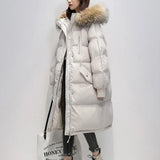 Lange Puffer Winterjacke mit Fell – Cremig