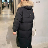 Lange Puffer Winterjacke mit Fell – Schwarz