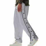 Herren nan weite Trackpants mit seitlicher Druckknopfleiste, elastischem Bund und reflektierendem Streamline-Streifen Drune – Grau