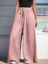 Damen nan weite Palazzo-Hose mit hohem Paperbag-Bund, elastischem Tunnelzug und vorderer Beinschlitz Drune – Rosa