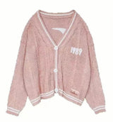 Damen nan kurz geschnittene Strickjacke mit V-Ausschnitt, Kontrastpaspel und oversized Ärmeln Drune – Rosa
