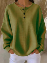 Damen nan Oversized Waffelstrick Henley-Pullover mit Knopfleiste und abgerundetem Saum Drune – Olivgrün