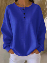 Damen nan Oversized Waffelstrick Henley-Pullover mit Knopfleiste und abgerundetem Saum Drune – Blau