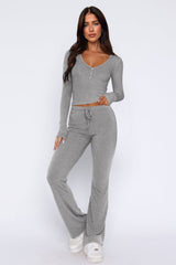 Laureen | Ausgestellter Jumpsuit mit langen Ärmeln – Hellgrau