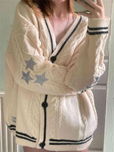 Damen nan oversized Zopfmuster-Cardigan mit V-Ausschnitt, Knopfleiste und Sternapplikationen Drune – Apricot-Schwarz