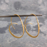 Spiralförmige Ohrringe – Gold