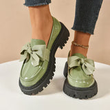 Eliza – Glänzende Plateau-Loafer – Grün