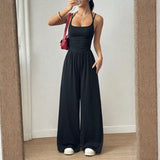 Bela™ Langer Jumpsuit mit weitem Bein, Doppelträgern und offenem Rücken – Schwarz