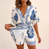 Azzurine™ Skort-Jumpsuit Mit Wickeloptik, Seitlicher Bindung Und Exklusivem Mediterranem Print – Blau