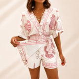 Azzurine™ Skort-Jumpsuit Mit Wickeloptik, Seitlicher Bindung Und Exklusivem Mediterranem Print – Rosa