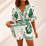 Azzurine™ Skort-Jumpsuit Mit Wickeloptik, Seitlicher Bindung Und Exklusivem Mediterranem Print – Grün