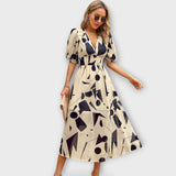 Maxikleid mit Ballonärmeln im abstrakten Design – Beige