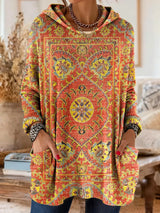 Vintage-inspirierte Kapuzenstrick-Tunika mit Taschen und ethnischem Druck – Orange