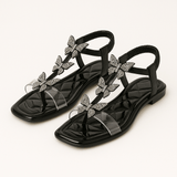 Lina - Glitzer-Sandalen mit Schmetterlingen und Zehenriemen – Schwarz