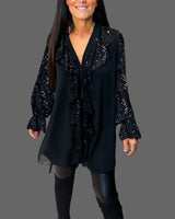 Moxie – Rüschenbluse mit V-Ausschnitt und funkelnden Pailletten – Schwarz