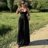 Damen Jumpsuit mit Spaghettiträgern V-Ausschnitt Überkreuztem Rücken und Weitem Bein – Schwarz