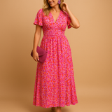 Damen Kleid mit kurzen Ärmeln, V-Ausschnitt und Blumenmuster mit Smokdetail – Rosa