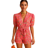 Damen Kurz-Jumpsuit mit Blumenmuster, V-Ausschnitt und Taillengürtel – Rosa