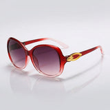 Damen-Sonnenbrille mit Schmetterlingsform und Metallic-Akzenten – Rot & Pink
