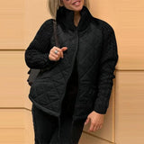 Damen Steppjacke mit Strickärmeln – Tiefschwarz