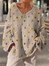 Damen Strickpullover mit bunten Herzmotiven und V-Ausschnitt – Beige