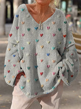 Damen Strickpullover mit bunten Herzmotiven und V-Ausschnitt – Grau