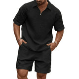 Herren-Set aus Poloshirt mit Viertelreißverschluss und Shorts mit Gitterstruktur – Schwarz