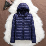 Manuela – Wasserdichte Jacke Mit Weißen Entenfedern – Marineblau