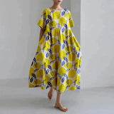 Jamila – Oversize-Kleid aus bedrucktem Baumwollleinen – Gelb